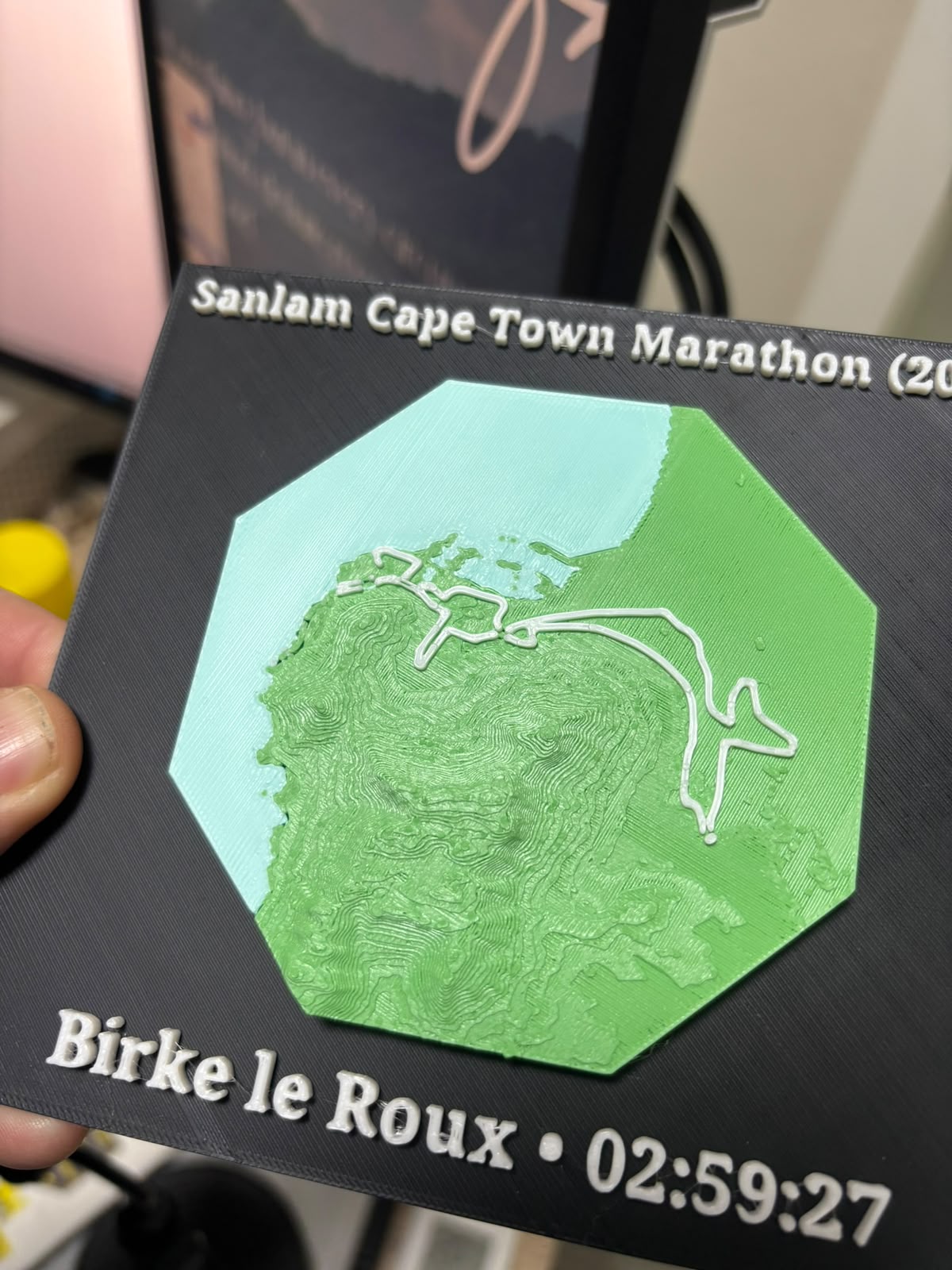 3D-printed TrailPrints plaque of the Sanlam Cape Town Marathon — green terrain contours, white route line, finish time 02:59:27